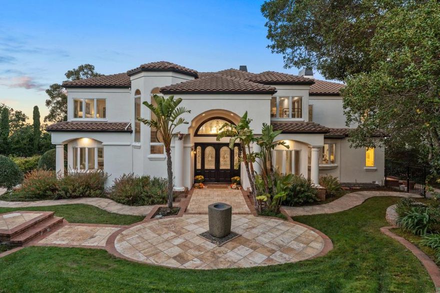 Discover the epitome of luxurious living at 10 Del Monte Drive, a stunning residence nestled in a esteemed neighborhood of Hillsborough. Spanning 5,292 sqft including finished basement and bath, currently used as wine cellar, gym and media room. This opulent home showcases 5 beds, 6.5 baths, ensuring ample space and privacy for residents and guests alike. Upon arrival, you are welcomed by lush greenery, leading you towards an ambiance of unmatched luxury. The gourmet chef's kitchen boasting a sizable island, seamlessly marries functionality with elegance becoming a centerpiece for culinary exploration. Large, airy living spaces encompass two distinct dining and two living rooms, each delineated for formal gatherings and intimate family times. Every glance through the windows unveils enchanting bay views, while soaring ceilings enhance the voluminous aesthetic throughout. Recent upgrades have been meticulously curated with designer upgrades, emanating a contemporary yet timeless appeal.