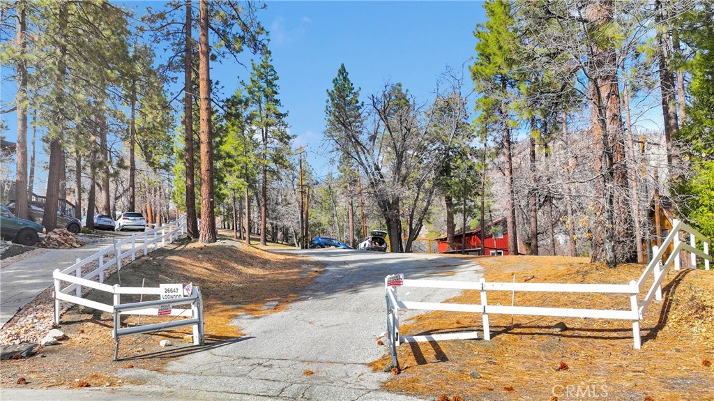 2+ Acres of Mountain Paradise in Wrightwood!
Tucked away at the end of a quiet private, paved road, this 2.03-acre parcel of mountain beauty on Logwood Drive is the perfect spot to build your dream mountain escape. Surrounded by towering pines and backing up to the national forest, this beautiful property offers the best of both worlds—total privacy while still being close to town.
* Over 2 acres of land – plenty of space for a custom home, guest house, or just room to roam.
* Stunning natural surroundings – enjoy crisp mountain air, forest views, and visits from local wildlife.
* Utilities nearby – electricity, natural gas, and water are available close to the property.
* Secluded, yet convenient – just minutes from Highway 2, Wrightwood’s charming village, and Mountain High Resort for skiing, hiking, and more.
* Endless possibilities – build your full-time home, weekend getaway, or a cozy cabin in the woods!
* Horse Property – Plenty of room for the corrals, barns and horses!
Whether you’re looking for a peaceful retreat, a place to enjoy nature, or an investment in mountain real estate, this property has it all. Don’t miss your chance to own a slice of Wrightwood’s beauty!
Buyer to verify zoning and building requirements with LA County.