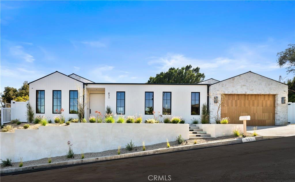 Photo of 831 Teakwood Road, Los Angeles, CA 90049 (MLS # SR26121677)