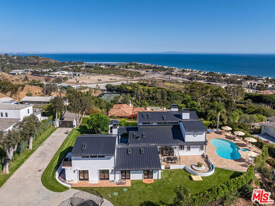 Perched above the coastline, this gated estate captures the essence of Malibu living - ocean views, complete privacy, and timeless character at every turn.  A sunlit courtyard with fountain welcomes you into a home where French doors frame sweeping horizons from nearly every room. The living and dining spaces flow effortlessly outdoors, while the chef's kitchen with Viking appliances anchors the heart of the home. The primary suite is a private retreat with vaulted ceilings, dual balconies, and a soaking tub overlooking the coastline. Guest suites open to gardens, and amenities include a home gym, double laundry, and abundant natural light throughout. Outside, a sparkling pool and spa with ocean views are surrounded by manicured lawns, sunlit terraces, and mountain vistas. Just minutes from Malibu Country Mart, the Malibu Pier, Nobu, Soho House, Pepperdine, and Malibu's world-renowned beaches, this rare lease embodies the very best of coastal living.  Available immediately, short or long term.