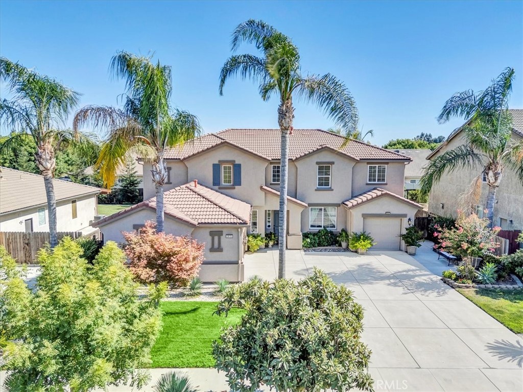 Tucked in a quiet Visalia neighborhood, this spacious two-story home offers room for everyone with three separate living areas and a smart layout designed for flexibility. The open kitchen is a true centerpiece - featuring granite counters, stainless steel appliances, double ovens, and a large island with bar seating - all flowing into the dining and family rooms for effortless entertaining.
Downstairs includes a bedroom and full bath, perfect for guests or multi-generational living. Upstairs, the primary suite boasts dual walk-in closets and a spa-like bath with soaking tub and dual vanities, while three additional bedrooms and a loft provide plenty of space for family or work-from-home needs.
Step outside to a lush backyard retreat with a covered patio and mature fruit trees - lemon, grapefruit, orange, pomegranate, and guava. A spacious laundry room and two-car garage complete this inviting property. Schedule your tour today!