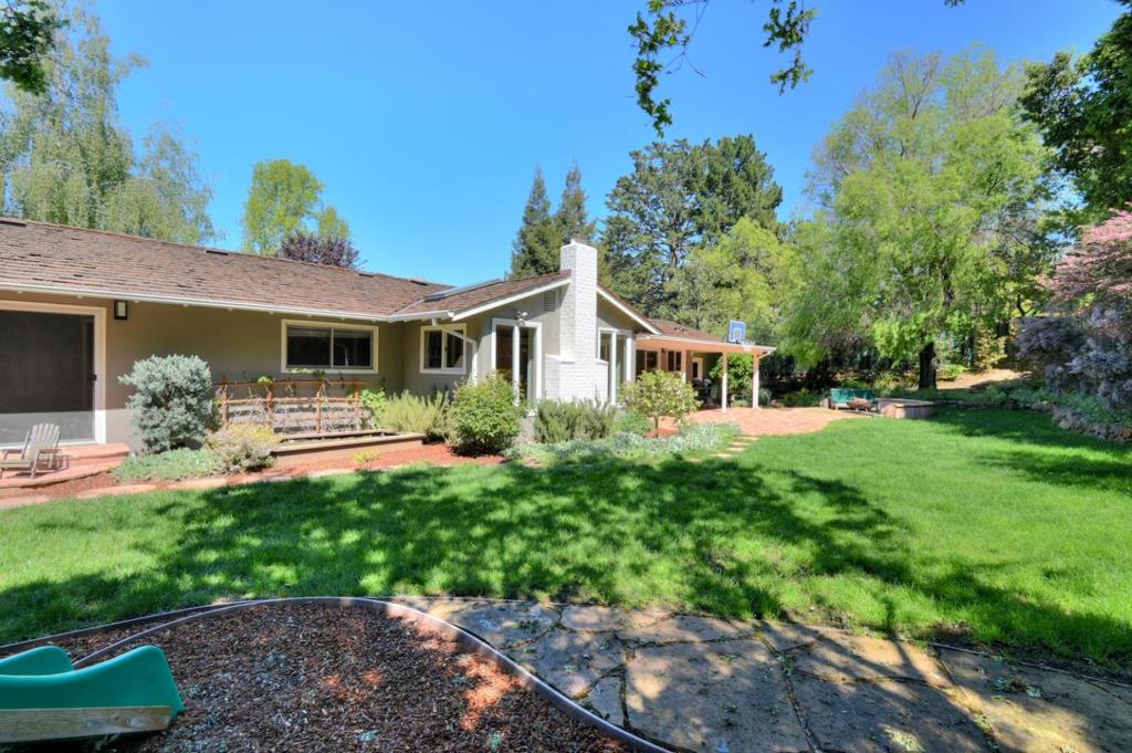 4 bedroom, 2.5 Bathroom on a 13,328 sf lot! . Remodeled Kitchen with SS 5 burner stove, breakfast bar adjacent to large family room with skylights, built in cabinetry - overlooking the spacious and level backyard. Hardwood floors, crown moldings and plantation shutters. Master suite features a remodeled master bath with Jacuzzi tub, frame-less glass shower and dual vanity sinks. 3 additional and spacious bedrooms. Raised dining room, hall bath w 2 sinks, breakfast area. FP in LR. LARGE 2 car garage