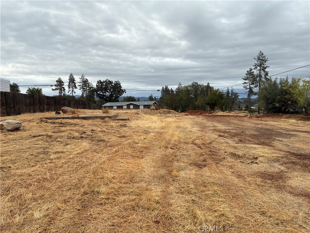 Enjoy the perfect canvas for your new home on this FLAT .61 acre lot in Paradise. Previously the site of a 2 bedroom, 1,281 sq. ft. home, the property is flat, clear, and ready for construction. The seller is covering the water connection, putting thousands back in your pocket. With ample space for a custom home and outdoor living, this lot offers both convenience and potential in a desirable location. Your dream home starts here!