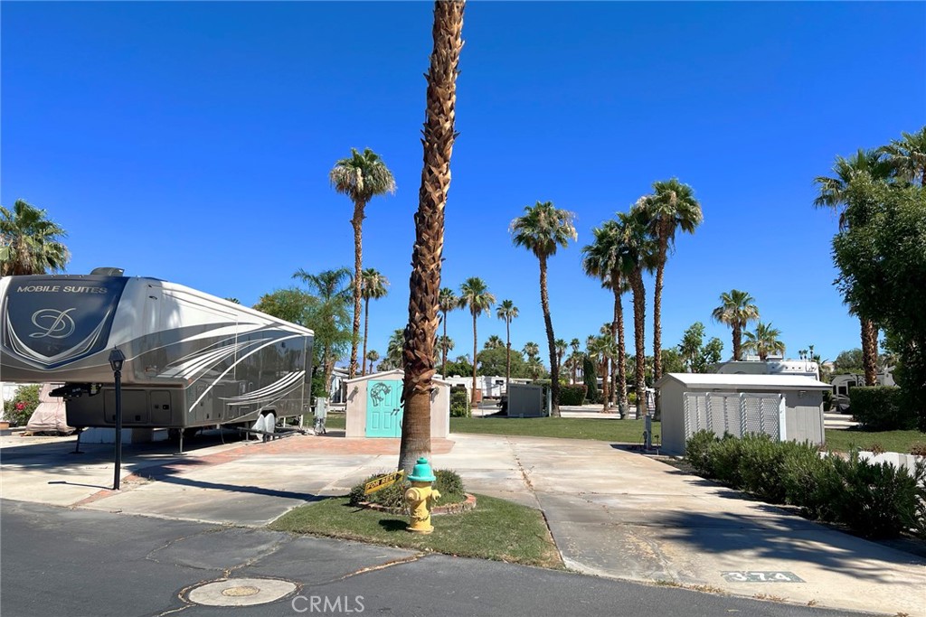 Highly sought after 55+ Seasonal Living "Desert Shadows RV Resort" RV Lot Now Available! You Own Land! On the Green Belt! Grant Deed Lot with Water, Cable, Trash, and common area included in HOA! Amazing amenities! 2 large & well-maintained clubhouses plus 3 additional satellite clubhouses, An indoor pool with a large spa and sauna, An olympic-size lap pool, A total of 6 pools, 5 spas and 3 saunas, Sunken, lighted tennis courts, 8 Pickle-ball courts, An indoor shuffleboard pavilion, 16,000-square foot San Jacinto room with floating hardwood dance floor, and a professional stage, plus a large kitchen, A 3,000-square foot “Our Gang” party room and lounge with a giant fireplace and kitchen, A huge party terrace with mountain views, A fully equipped fitness center, A dance studio, Library, Billiards room, Horseshoe pits, Several laundries, restrooms and bath facilities, Card & hobby rooms with Pottery Kiln, A putting green, Organized fitness activities, Daily activities including dances, dinners and entertainment, Wi-Fi and wired broadband Internet access. Close to everything!