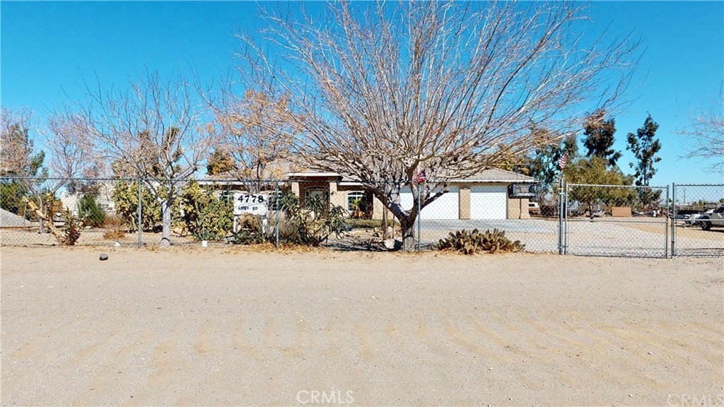 INCREDIBLE opportunity to turn this property into your dream home!! This stunning home is situated on a peaceful. As you step inside, you're greeted by a beautiful tiled entryway that leads to the open floor-plan kitchen, dining area, and family room. The kitchen has granite counters, a five-burner range, a pantry, and an island. Spacious single-story residence built in 2006, offering 1,998 sq ft of living space on a 1.95-acre lot. Features 3 bedrooms, 2 full bathrooms, and a welcoming fireplace in the living room. The master bedroom retreat has a large sleeping area, a lounge area for your private activities, a big attached bathroom, a jacuzzi, double sinks, and a large walk-in shower. Central Air conditioning and Evaporative cooler unit duct throughout the house. 3 bedrooms all have ceiling fans Place has an attached 3-car garage and a huge workshop.