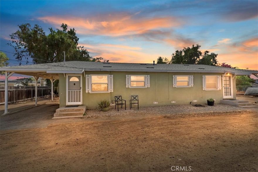 CUTE LITTLE COTTAGE! Located in the heart of Norco and all the fun activities Norco has to offer.  Situated near the Santa Ana Riverbed where you can go on nightly sunset walks along the riverbed or close enough to 6th St where all the activities and parades are.  Upgrades include new water heater, brand NEW interior PAINT and BRAND NEW CARPET just installed and is ready for move in.  Just bring your furniture and make this your own.  Kitchen overlooks the family room adding a cozy atmosphere with family.  There are 2 full bathrooms and spacious bedrooms. The primary suite has a sitting room with added space.  There is wood laminate flooring through-out.  There are 2 cattery's perfect for someone with a cat or small dog to enjoy the outdoors if they are an indoor pet.  There are 2 carports for parking and plenty of room for 1 horse or build yourself a garden and enjoy your own little homestead.  Plenty of room for a chicken coop, goats, pigs, bring them all. The shed is included and perfect for extra storage.  Perfect price to live in Norco "HORSETOWN USA"  where you can enjoy what our city has to offer.