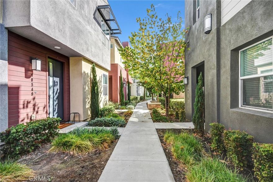 Welcome to this beautifully maintained 3-bedroom, 2-bath condo that perfectly blends comfort, style, and convenience. The inviting open floor plan is filled with natural light, creating a bright and airy atmosphere throughout. The upgraded kitchen serves as the heart of the home, featuring elegant shaker cabinetry, gleaming granite countertops, stainless steel appliances, and a spacious island ideal for casual dining or entertaining. The primary suite offers a private retreat with a walk-in closet, dual vanity sinks, and a sleek walk-in shower, while two additional bedrooms provide flexibility for guests, a home office, or a cozy creative space. Additional highlights include in-unit laundry, central A/C, a tankless water heater, and an attached two-car garage. Enjoy resort-style community amenities including a sparkling pool, relaxing spa, fitness center, clubhouse, and BBQ area. Conveniently located near shopping, dining, top-rated schools, and major freeways, this home offers the perfect blend of luxury and everyday ease.