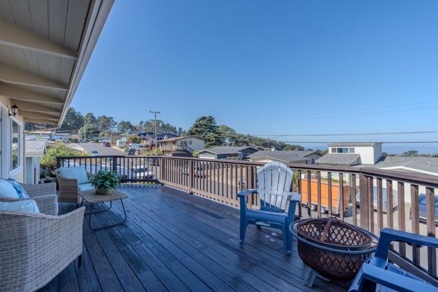 Ocean View Manor Home with versatile multi-generational living possibilities! Freshly painted inside and out, this property shines with refinished hardwood floors, new appliances, and vaulted ceilings. Multiple skylights and sliding glass doors fill the home with natural light. The flexible floor plan includes 2 full kitchens and 2 laundry hook-ups, ideal for extended family, in-law suite, or rental income. Enjoy two decksone with ocean views and another designed for BBQs and private entertainingplus a large flat yard perfect for outdoor living. A 2-car garage provides ample parking and storage. Conveniently located near beaches, hiking trails, schools, and shopping, this rare coastal retreat offers both lifestyle and opportunity.OWNED SOLAR. Climate-controlled garage.