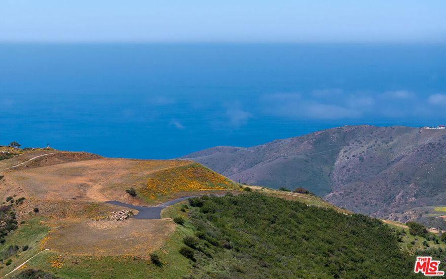 RTI** Introducing a once-in-a-lifetime opportunity to own approximately 19 acres of pristine land perched on the western flank of the Santa Monica Mountains, offering what may be the most commanding panoramic views in all of Malibu. This extraordinary estate site comes with Ready-To-Issue (RTI) permits available now so you can call your contractor, line up your backhoe, and have your grader digging footings the day escrow closes. Take a breath and decompress as you take in sweeping vistas of the Channel Islands, Ventura, and the Santa Barbara coastline. In the cooler months, watch snow dust the entire Topa Topa mountain range, stretching from Ojai to Moorpark, while sipping coffee from the comfort of your living room. To the east, the views transition from Boney Ridge in all its rugged glory to the layered peaks and valleys of the Santa Monica Mountains, ending in twinkling city lights from Manhattan Beach, Palos Verdes, and Catalina Island on the horizon.World-renowned artist Charles Arnoldi designed every element of the approved 9,627-square-foot architectural residence, from the precise placement of pocket sliders and picture windows to maximize each dramatic sightline, to interior walls perfectly positioned for showcasing significant art collections. The modern estate plan also includes a sophisticated guesthouse/ADU and a striking zero-edge pool designed for serious swimmers and serene moments alike. This site is construction-ready, with a 1,000-foot deep well, two large water tanks, a concrete driveway, and underground utilities already in place. Expansive patios and sculpted landscaping are envisioned to celebrate California's iconic indoor-outdoor lifestyle, from sunrise meditations to golden-hour dinners. Located just 7 minutes from the beach and 23 minutes from Camarillo's private "Cloud 9" airport, this is Malibu living elevated to its highest expression.