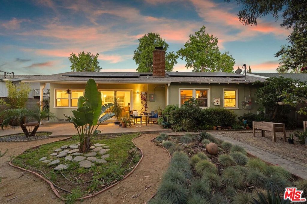 Located on a quiet residential street in the heart of Van Nuys, this updated 4 bedroom home offers modern convenience and comfort. Chisholm ave is essentially a circular street with no through traffic and all family owned residences. The home features 4 bedrooms an open floor plan, two full bathrooms, and a spacious two-car garage. Solar panels provide energy efficiency, while the beautifully landscaped backyard, filled with California native plants, provides an inviting outdoor space. Just minutes from the 405 freeway and Van Nuys Airport, Studio City and Sherman Oaks, this home offers easy access to Ventura Blvd's eateries and boutique shops. With its thoughtful design and sustainable features, this residence is perfect for those seeking a contemporary lifestyle.