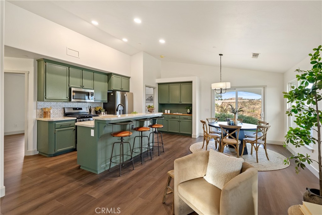 Discover this beautifully updated 1,200± sq.ft. home set on 10± acres in San Miguel, featuring 9± acres of vineyard. Freshly remodeled with custom finishes, the residence offers new flooring, paint, and appliances for a move-in-ready experience. The open layout creates a welcoming flow between the living room, dining area, and kitchen, complete with bar counter seating. Vaulted ceilings and expansive windows frame sweeping vineyard views, enhancing the home’s modern aesthetic with a sense of light and space. Adding even more value, the property includes approved plans and a permit to build an ADU, offering future flexibility for guests, rental income, or multi-generational living. This property perfectly combines the charm of wine country living with the comfort of a stylish, updated home.