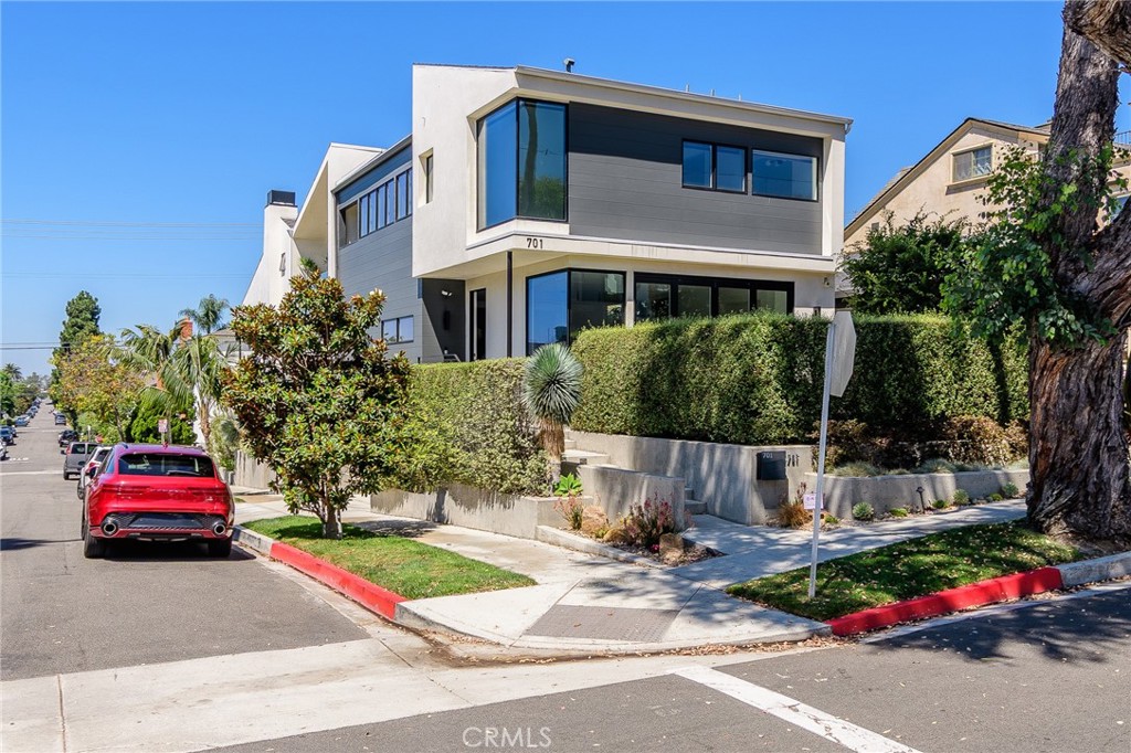 Experience modern coastal living in this beautifully designed three-bedroom home, showcasing wood floors and high-end finishes throughout. The chef’s kitchen is a showstopper with professional-grade Thermador appliances, including a six-burner range with dual ovens, sleek cabinetry, and a large center island for entertaining. Bi-fold glass doors open seamlessly to a private patio, creating the perfect indoor-outdoor flow. The primary suite is a serene retreat, highlighted by a corner window that maximizes natural light. Two additional bedrooms provide comfort and flexibility for guests, a home office, or family living. For the ultimate in relaxation and entertaining, the rooftop deck offers sweeping ocean views—ideal for sunset gatherings or quiet mornings by the sea.