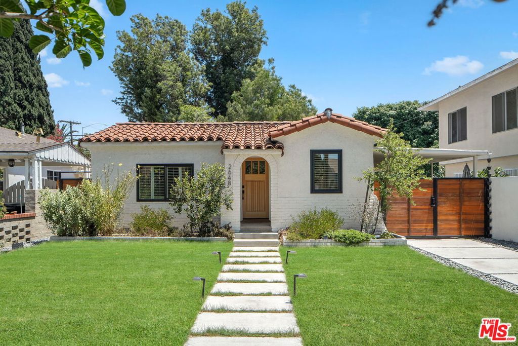 Nestled in the heart of Reynier Village and set behind a freshly landscaped yard, 2648 S Halm immediately impresses with its modern curb appeal, complete with a new driveway, gated carport, and freshly painted exterior. This charming 3 bedroom, 2 bathroom Spanish home offers a total of 1,147 sqft of stylish and functional living space, divided between a 2 bedroom, 1 bathroom main residence (848 sqft) and a versatile 1 bedroom, 1 bathroom Accessory Dwelling Unit (ADU) spanning 299 sqft. Set on a spacious 4,143 sqft lot, this property delivers the sought-after 'village feel' right in the heart of Los Angeles. Through a graceful archway, step inside to find a thoughtfully designed blend of history, modern fixtures and fittings for today's lifestyle. Full of character and natural light, this home welcomes you with a bright living space featuring coved ceilings and traditional charm. The living and dining areas flow seamlessly and are accented by modern fixtures, offering a warm, contemporary feel. Enjoy the upgraded kitchen featuring refaced cabinetry, polished countertops and a suite of new stainless steel appliances. The main residence boasts two generously sized bedrooms, each with custom Elfa closet systems, while the renovated bathroom is outfitted with black modern hardware, a new medicine cabinet, and integrated lighting. Outside, you'll find a serene, private yard, professionally designed with vibrant landscaping and equipped with a firepit and covered patio - perfect for entertaining or dining al fresco. The garden features beautiful native plants that attract a vibrant array of birds, bees, and butterflies, creating a lively sanctuary. The detached ADU is equally refined, offering added flexibility with extra kitchen storage and bonus attic space - ideal for a home office or visiting guests. Additional highlights include new AC in the main house, updated electrical with grounded outlets, new water heater and more. Located in a prime Westside location with seamless access to Beverlywood, Culver City, and Beverly Hills, and close to shops, restaurants and entertainment. Active lifestyles will appreciate the mere 5 minute bike ride to the Ballona Creek bike path and nearby pickleball and tennis courts. This turnkey home offers comfort and convenience in one of Los Angeles' trendiest neighborhoods.
