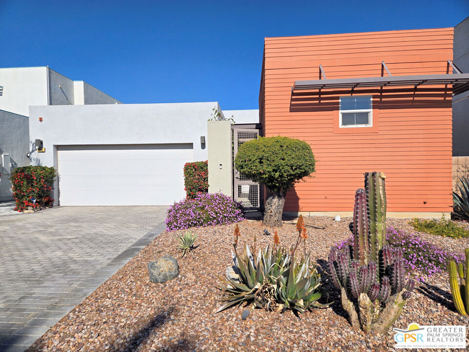 Welcome to this private gated compound in highly desirable Escena in Palm Springs. The single-story light-filled main house features an ensuite primary bedroom with a large shower and separate soaking tub. A second ensuite bedroom with a shower has direct access to the pool and spa. Additionally, there is a guest bath. The separate ADU is an ensuite 1 bedroom with a large closet and access to a patio. For those who like to cook, the modern kitchen has a large pantry, microwave with infrared cooking, separate self-cleaning oven, gas cooktop, and a 4 door refrigerator. The large open living area features a large dining area, fireplace, and separate area for additional living or dining. The separate laundry room has a large sink and abundant cabinets. There are 2 patios, one with a fire pit. From the swimming pool and large spa, you can watch the tram on Mount San Jacinto. There is a 2 car attached garage with storage shelving. The house has solar panels which significantly cuts down on electric bills, and in some years a refund has been received. Outside, desert landscaping cuts down on water use, while the sides and back have large Calliandra hedges for increased privacy. The ADU can be used to generate income as a rental unit (must be more than 30 days). Some furnishings are available for purchase after close of escrow. Seller is a licensed California realtor.