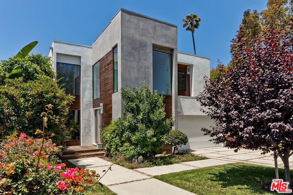 Open, airy and brimming with personality, this 5 bedroom/7 bath modern-style, two-story home on a uniquely family-friendly street in Mar Vista has such a strong design aesthetic, every room takes you on a different adventure. Impossibly high ceilings and surrounded by glass, the home is awash in an abundance of natural light and offers a peaceful, tranquil feeling from the moment you step inside. Hardwood floors, clean lines and effortlessly blending a minimalist elegance with a unique sense of self, this 4225 sq ft home provides luxury living without pretension. Stainless Viking appliances, wine fridge, custom cabinetry, walk-in pantry in the gourmet kitchen, exquisitely designed for the at-home chef. The kitchen opens to vast spaces including a Great Room, formal Dining and Living rooms. Floor to ceiling glass doors slide open to disappear into the walls, extending the interior to the wholly private backyard which offers a beautiful swimming pool, hot tub, built-in barbeque and entertaining area tucked beneath a picturesque pergola. Upstairs are the living quarters and here you will find spacious bedrooms with attached bathrooms, each room offering a distinct character. The primary bedroom has an enormous walk in his/her closet, balcony that overlooks the yard and a lovely bathroom with oversized tub, intricate tilework, two sinks in the vanity and a view that stretches all the way to the ocean. Located on a fun, neighborly street near the shops, restaurants and schools of Mar Vista, this is an artistically significant home that isn't afraid to be bold.