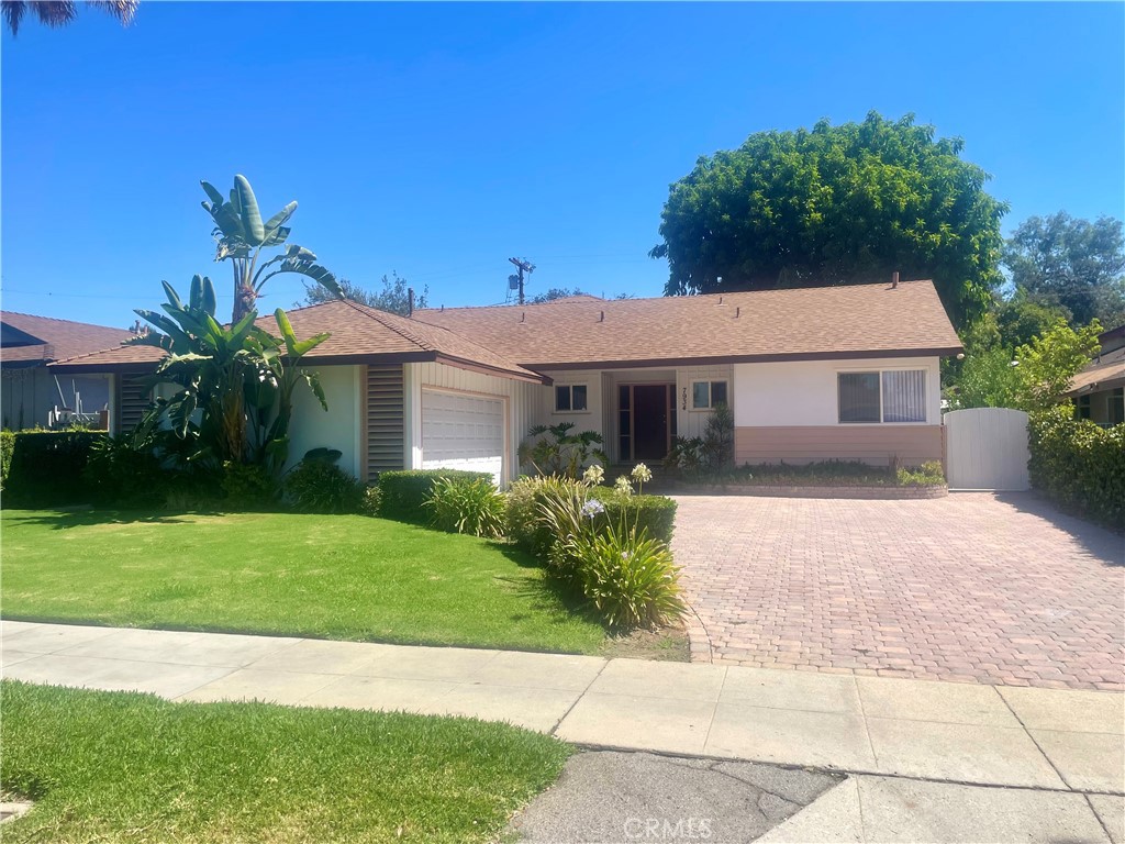 Canoga Park stunner- updated & walking distance to lanark park! welcome to 7934 Vassar st -4-bedrooms 3-bathrooms 2,326 sq.ft. living space and large 7,503 sq.ft. lot - updated ,move-in ready in one of Canoga Park most desirable locations, nestle on a tree line stree ,this home blends modern style and original charm, comfort,and convenience .step inside to a bright, open- concept layout with abundant natural light and stylish finishing throughout. sleek kitchen features ample cabinetry, stainless steel appliances, and beautiful granite countertops, making it perfect for cooking and entertaining.step down to a huge family room with abundant natural light , big dining area, kitchen breakfast area, beautiful living room with a cozy fire place , spacious master- suite and master-bath privately situated upstairs. Additional three bedrooms two bathrooms downstairs, mirrored closet doors, nicely landscaped front yard and private backyard, enjoy back patio for coffee or evening relaxation,. the attached two car garage offers washer and dryer hookups ****Hightlights** updated and freshly painted interior. new roof, fresh exterior paint , new tankless water heater ,central AC,stainless steal appliances, recessed lighting throughout, driveway with nice pavers, newer doble pane vinyl windows, walking distance to park,shoping,and restaurants, ***don't miss this rare Canoga Park gem-schedule your showing today!!!