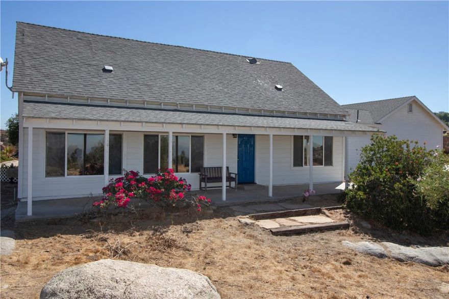 A custom home in the Temecula wine country. Property has a Main home, a detached guest house, a large detached garage-workshop, and a barn with corrals all on 10 acres of land! Located above the highly desirable Glenoaks Hills area in the heart of the Temecula wine country. Ten acres with 360 degree views of Lake Skinner and the wine country and city lights! Enter the main home into a spacious living room with a bank of windows to take in the fantastic views. Your gaze will be drawn to the spiral staircase leading to the upstairs huge 4th bedroom/office. The sunny and bright kitchen with custom cabinetry and granite counters, and large island with seating, and a pantry offers plenty of storage space. The outdoor covered patio welcomes you to relax and enjoy the view and watch the hot air balloons glide overhead. The private Guest house, Casita with its separate entrance offers an open concept floorplan with kitchenette and full bath. The combined living area for the home and casita totals over 2500 sqft! A detached garage has been drywalled and the workshop floor sealed with epoxy, perfect for a pool table or hobby game room, leaving the remaining bay space available for parking, and access to the attached laundry room. Additionally, there is an office room with a private entrance attached to the garage. The horse facilities include a 36X48 barn with in and out stalls with welded wire panels, with large open span area for tractor parking, tack or hay storage. There are additional turnouts with covered corrals. The twenty solar panels are seller owned. There are two permitted wells that are not in use as property is connected to municipal water source. Water bond has been paid in full. Low taxes! Property split potential.