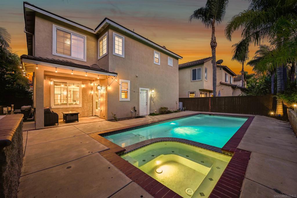 Welcome to San Lorenza, where elegance meets comfort in Torrey Highlands! This stunning Tuscan-style residence boasts the community’s largest floor plan and an OWNED SOLAR SYSTEM, designed for both entertaining and everyday living. Enjoy formal living and dining rooms, a spacious family room with fireplace and custom built-in storage, and an upgraded gourmet kitchen with extra-deep pantry and abundant cabinetry. Tucked at the end of a cul-de-sac, this home offers one of the largest backyards in the neighborhood, complete with a private heated pool and spa, covered patio, built-in BBQ, and custom retaining walls—an entertainer’s dream! The extra-long driveway accommodates up to four cars. Upstairs, you’ll find four generously sized bedrooms and a versatile office/tech nook near the laundry room. The luxurious primary suite was recently upgraded to spoil you rotten and also features a large walk-in closet, dual vanities, soaking tub, and separate shower. Bedrooms 2 and 3 share a spacious dual-vanity bath, while Bedroom 4 includes its own en suite bath and walk-in closet—perfect for guests or as a second primary suite. Additional highlights include upgraded flooring, central air conditioning, and a convenient powder room downstairs. Just minutes from Torrey Pines Beach, Highway 56, and top-rated Poway Unified schools, this home also offers easy access to Rancho Peñasquitos Preserve, Canyonside Park, the YMCA, and the public library.