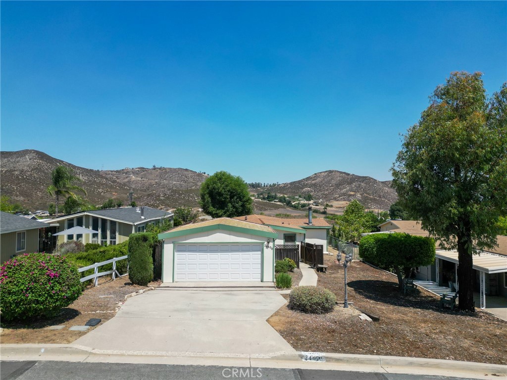 Discover the perfect blend of comfort, updates, and community living at 24400 Wagon Wheel Ln! This meticulously maintained 3-bedroom, 2-bathroom manufactured home on permanent foundation offers 1,880 square feet of thoughtfully designed living space on an expansive 7,405 square foot lot.
EXTENSIVE RECENT UPDATES:
Step into a home that's been lovingly refreshed with significant improvements including a brand-new roof, completely new HVAC system with ductwork, recently leveled manufactured home for optimal stability, beautiful newer LVP flooring throughout, and fresh paint that creates a bright, welcoming atmosphere.
THOUGHTFUL INTERIOR FEATURES:
The heart of the home showcases a kitchen with convenient island countertop, perfect for meal prep and casual dining. Unwind in the master suite featuring a luxurious jetted tub for ultimate relaxation. Entertainment enthusiasts will love the unique inside bar - perfect for hosting friends and family gatherings.
OUTDOOR LIVING & PARKING:
The generous lot size provides endless possibilities for outdoor enjoyment, while the garage and driveway offer convenient parking solutions.
COMMUNITY LIFESTYLE:
Located in the sought-after Farm community, residents enjoy resort-style amenities including sparkling pools, baseball field for active families, tennis court for recreational play, and a peaceful pond perfect for fishing. This family-friendly environment is ideal for first-time buyers and growing families.
CONVENIENT LOCATION:
Served by Lake Elsinore Unified School District, this home offers the perfect balance of peaceful community living with easy access to Wildomar's shopping, dining, and recreational opportunities.
READY FOR IMMEDIATE ENJOYMENT:
With all major systems updated and move-in ready condition, this home represents exceptional value
FHA ASSUMABLE LOAN 3% INTEREST RATE!!