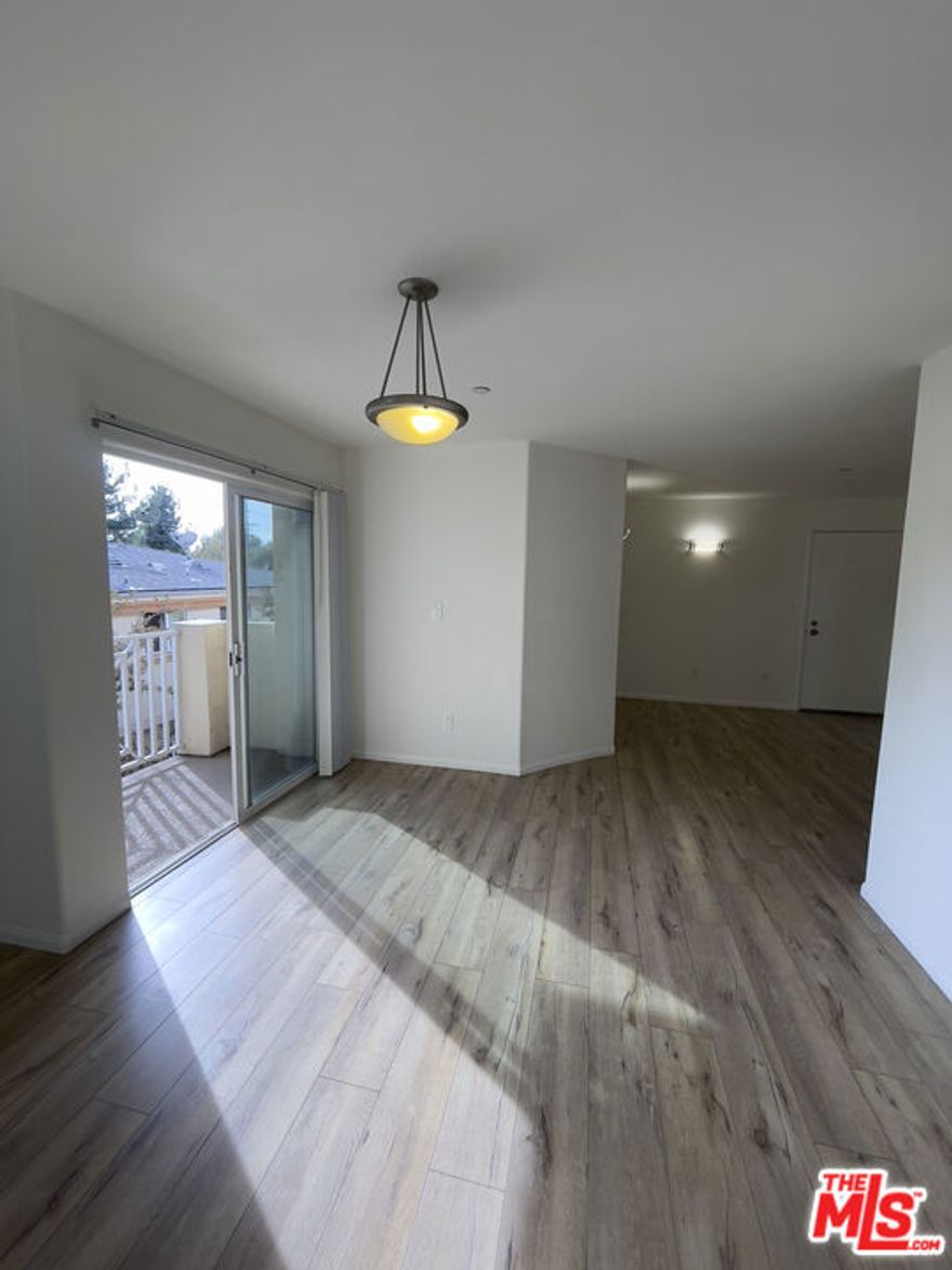 Now available for immediate move-in, this spacious 2-bedroom, 1-bathroom residence is tucked away in the peaceful rear building of a well-maintained gated community in the sought-after Lake Balboa neighborhood. Offering approximately 875 sq. ft. of bright, comfortable living space, this unit features laminate and tile flooring throughout, central A/C and heating, and a modern, well-appointed kitchen complete with a stove, refrigerator, and microwave. Enjoy the convenience of two reserved parking spaces, on-site laundry facilities, and access to a shared community BBQ area perfect for relaxed weekend gatherings. Situated just minutes from Lake Balboa Park, the Sepulveda Basin Recreation Area, the Japanese Garden, Balboa Sports Complex, and Woodley Park, you'll have endless options for outdoor enjoyment. Plus, with easy access to the 405 and 101 freeways, nearby grocery stores, local restaurants, coffee shops, and the Orange Line bike path, everything you need is right at your fingertips. This inviting and centrally located unit combines comfort, convenience, and exceptional value.