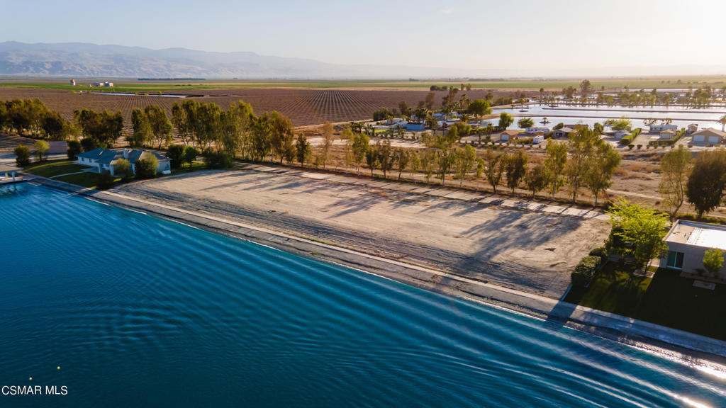 Extraordinarily unique opportunity to build your own custom estate with a dock on a private lake!! This lot is one of three lots available on Paradise Lakes in Arvin California. The remarkable gated community is truly one of a kind. Paradise Lakes Estates has its own private airstrip between the two lakes that can accommodate all single engine and some twin-engine aircrafts. It is the only lake in the area that allows larger 23.5 ft wakeboarding boats to be used. Build your own custom dream home next to world class competition ski lakes and create memories that will last a lifetime! Don't miss out on this rare opportunity, call for much more information!