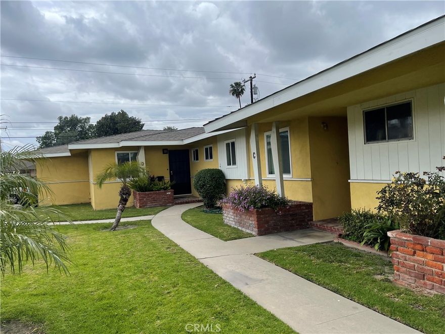 Remodeled 2-Bed, 1-Bath Single-Story Unit in a Quadruplex unit #D.  Welcome to this beautifully 2-bedroom, 1-bathroom located in end unit. This charming unit features fresh paint throughout, brand-new dual-pane French doors, and newer dual-pane windows in the bedrooms and living room for energy efficiency and comfort.  Enjoy the warmth of repolished oak hardwood floors and refreshed kitchen cabinets, complemented by durable tile flooring in both the kitchen and bathroom. Each room is equipped with a new ceiling fan for added comfort. Relax or entertain on the spacious private patio perfect for B.B. Q, morning coffee, or simply enjoying the outdoors. The home also includes a detached one-car garage and is conveniently located near shopping centers, restaurants, parks, major freeways, and Disneyland.