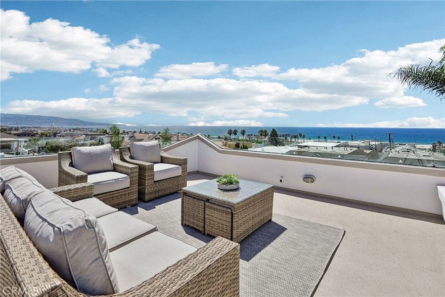 Welcome to 1550 Monterey Blvd. This is an extraordinary opportunity to own one of Hermosa Beach’s most coveted corner-lot residences, where panoramic ocean views stretch from Catalina to Malibu and the beach is just three blocks away. A Home That Captivates at Every Turn - This 2,700-square-foot Santa Barbara-style masterpiece is more than a home—it’s a sanctuary. From the moment you step inside, you’re greeted by rich European walnut hardwood floors and a layout designed to celebrate the sea. The upper level is a showstopper: expansive windows frame the ever-changing Pacific, while the open-concept living and dining areas invite you to linger over sunsets and starlit evenings. Designed for Entertaining & Everyday Joy - The chef’s kitchen is a dream, featuring stainless steel appliances, granite countertops, a walk-in pantry, and a dedicated chef’s desk for planning meals or organizing your day. A wet bar and ocean-facing balcony make hosting effortless, while the dining room offers front-row seats to golden hour. On cooler nights, gather around the fireplace under the domed skylight for a magical evening of stargazing. Retreat to Comfort & Serenity - Downstairs, the second level offers three spacious bedrooms, including a luxurious primary suite with a spa-inspired bathroom, double-sided fireplace, and a generous walk-in closet. This level also includes a second full bathroom for guests or family. On the first floor, you’ll find a versatile family room—perfect for movie nights, playdates, or quiet mornings on the patio—alongside a third full bathroom, a full laundry room, and direct access to an oversized two-car garage. The top floor features a convenient powder room, adding flexibility and comfort to the main living space. Location, Lifestyle, Legacy - Situated in the heart of Hermosa Beach, this home places you just steps from vibrant nightlife, boutique shopping, and a diverse array of dining experiences. Whether you're strolling to the sand or savoring ocean breezes from your balcony, every day feels like a vacation. Don’t Miss This Rare Gem - Homes like this are few and far between. With its unbeatable location, timeless design, and sweeping views, this property is a true crown jewel. Schedule your private showing today and prepare to fall in love.