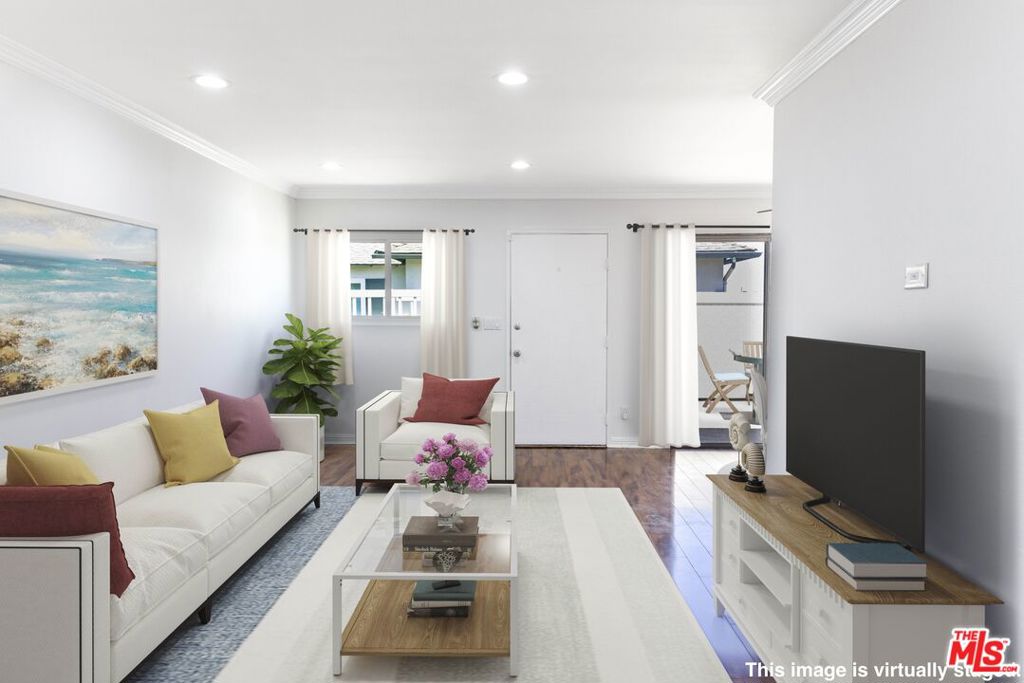 Welcome to your beautifully upgraded townhome in the heart of Harbor City! This 3-bedroom, 2-bathroom end-unit offers the perfect blend of modern comfort, energy efficiency, and smart home convenience. Step inside to find new flooring in living room and dining room area are wood laminate, complemented by brand-new vinyl flooring in the kitchen and laundry areas and tile in the bathrooms. The spacious living room and hallway shine with recessed lighting, easily controlled by Lutron smart dimmers for custom ambiance at your fingertips. Enjoy year-round comfort with a central A/C system and upgraded 100-amp electrical panel. TECH lovers will appreciate the data wiring throughout, Ring doorbell and alarm system, and modern outlets with built-in USB charging in multiple rooms. The bedrooms also feature new ceiling fans for added comfort in the bedrooms. The kitchen is equipped with a double oven range, over-the-range microwave, and new dual-pane windows in every room to enhance energy efficiency. Both bathrooms have been refreshed with updated fixtures, new lighting, and ventilation fans to elevate the overall feel. New skim Coated smooth Ceiling, new whitewashed kitchen cabinets. The attached 2-car garage includes a smart garage door opener with battery backup, offering both convenience and peace of mind. Dedicated laundry room with existing hookups for side-by-side washer and dryer, washer / dryer not included. This is the smart, stylish home you've been waiting for ideally located in a desirable, well-maintained community, close to parks, schools, shopping, and easy freeway access.