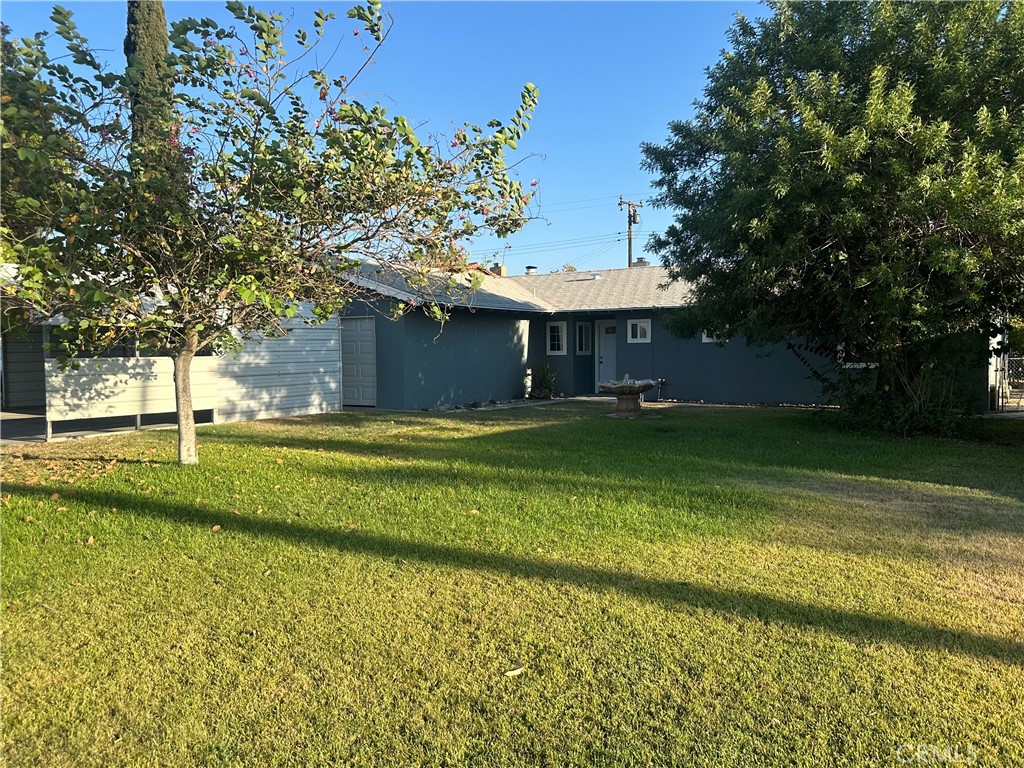 Beautiful Large 4BR, 2BA Single Story Home w/ Attached 2 Car Garage & Oversized Attached Carport. This home has been beautifully remodeled w/perfect blend of modern finishes & endless potential. Some of the homes Upgrades include New Waterproof Laminate Flooring throughout, New recessed lighting, fresh paint inside & out. Family Room comes w/ Beautiful Slate Stone Fireplace. There is functional open flow from family room to kitchen. The kitchen has been renovated w/ contemporary cabinetry, new quarts stone counters, new garbage disposal & new pull out faucet. Bathrooms have been remodeled w/ new toilets, new vanities, tiled walls, all new plumbing fixtures & light fixtures. Nice sized Bedrooms w/ sliding mirror doors. Besides the abundance of parking, home also has huge front yard along w/ a large storage shed in the backyard. This is great property and a must see.