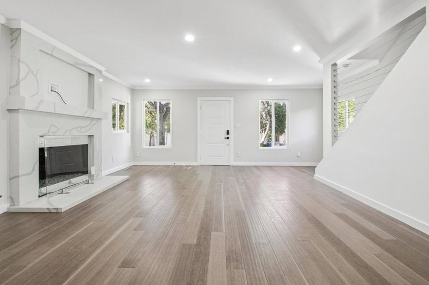 Privacy, modern design, and a peaceful setting come together in this quiet 3-bedroom, 2-bath home in the heart of North Hollywood. You are welcomed into an open living area with rich flooring, recessed lighting, and a decorative fireplace that brings a polished focal point to the room. Large windows keep the space bright, and there is plenty of room to relax, entertain, or enjoy unhurried evenings at home.  The kitchen sits within view, offering an elegant place to cook and gather. Sleek cabinetry, generous counter space, and stainless steel appliances create an organized and refined environment that supports everyday meals and weekend hosting.  Three well-proportioned bedrooms provide calm retreats, paired with two thoughtfully finished bathrooms for convenience and comfort. Pets are welcome, allowing your four-legged companions to enjoy the home alongside you.  Located in a quiet and private pocket of North Hollywood, this address places you minutes from grocery options like Ralphs and Gelsons, as well as lively dining and cafés along Lankershim Boulevard and the NoHo Arts District. Nearby parks, including North Hollywood Park, offer room to stretch outdoors, while easy access to major routes makes commuting simple.