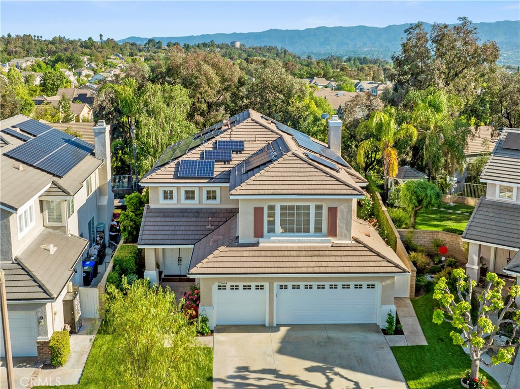 Welcome to this beautifully updated home nestled on a quiet cul-de-sac in the highly sought-after Northbridge Point community of Valencia. Offering 5 spacious bedrooms, 3 bathrooms, and a 3-car garage, this residence blends timeless charm with modern updates.
Freshly painted inside and out, the home boasts a traditional yet functional layout featuring formal living and dining rooms, an expansive family room with custom built-ins, and a warm, inviting kitchen. The chef’s kitchen is equipped with premium Viking stainless steel appliances, including a built in refrigerator, granite countertops, a stylish stone backsplash, and a custom center island—ideal for entertaining.
The main floor includes a convenient bedroom and full bathroom, perfect for guests or multigenerational living, as well as a laundry room. Upstairs, an oversized bonus room offers versatile space—ideal as a game room, secondary living area, or easily convertible into a sixth bedroom.
The primary suite provides a serene retreat, featuring dual closets, granite-topped vanities, a newly renovated spa-style shower with dual shower heads, and a private balcony to enjoy stunning sunset views. Secondary bedrooms are generously sized to comfortably accommodate family or guests.
The spacious backyard offers ample grassy area with potential for a future pool, a covered patio perfect for outdoor gatherings and a tranquil setting with beautiful rose garden with expansive views to enjoy year round. A large solar system provides savings on your energy bills.
As a resident of Northbridge Point, enjoy access to two exclusive community recreation centers with pools, spas, paseos, and a clubhouse. Conveniently located within walking distance to shopping centers, restaurants, top-rated schools, and everyday essentials, this home truly has it all.