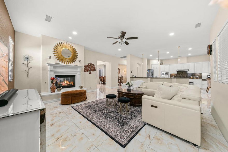 Located in one of North La Quinta's most established and sought-after neighborhoods, this exceptional residence offers a rare blend of over $350,000 in custom upgrades, a highly flexible floor plan, and close proximity to highly regarded International Baccalaureate (IB) schools within Desert Sands Unified School District. Thoughtfully designed for modern living, the home is ideal for multigenerational households, professionals working from home, culinary enthusiasts, or those seeking space to entertain or operate an in-home business--without compromising elegance or comfort.A long driveway, mature landscaping, fruit trees, and inviting courtyard spaces create a welcoming first impression. Inside, formal living and dining rooms provide refined spaces for gatherings, while the expansive great room offers an open, relaxed setting for everyday living. High ceilings, abundant natural light, and a seamless flow throughout enhance the home's sense of openness and sophistication.A standout feature is the dual-kitchen configuration, rarely found in the La Quinta market. The primary kitchen is a true chef's kitchen, built from the ground up with top-tier appliances, a convection oven, extensive special-order cabinetry, and exceptional storage--perfect for entertaining and serious cooking. A second full kitchen adds remarkable flexibility, ideal for extended family living, guests, catering, baking, or dedicated prep space.The home features over $30,000 in upgraded flooring, designer wallpaper, and carefully curated finishes throughout. Spacious bedrooms provide privacy and comfort, while multiple flex spaces can easily adapt as offices, studios, fitness rooms, or guest suites. A private office with its own exterior entrance offers an ideal setup for an in-home business or private guest quarters.Outdoor living is equally impressive with paver patios, courtyard-style spaces, and beautifully established landscaping--perfect for entertaining or relaxing year-round. Dual air conditioning systems ensure efficient comfort in every season.Ideally situated near parks, walking paths, golf, shopping, dining, and Old Town La Quinta, this home combines lifestyle convenience with access to top-tier education. With its extensive upgrades, dual kitchens, immaculate condition, and prime North La Quinta location, this is a rare opportunity to own a truly versatile and exceptional home designed for the way people live today.