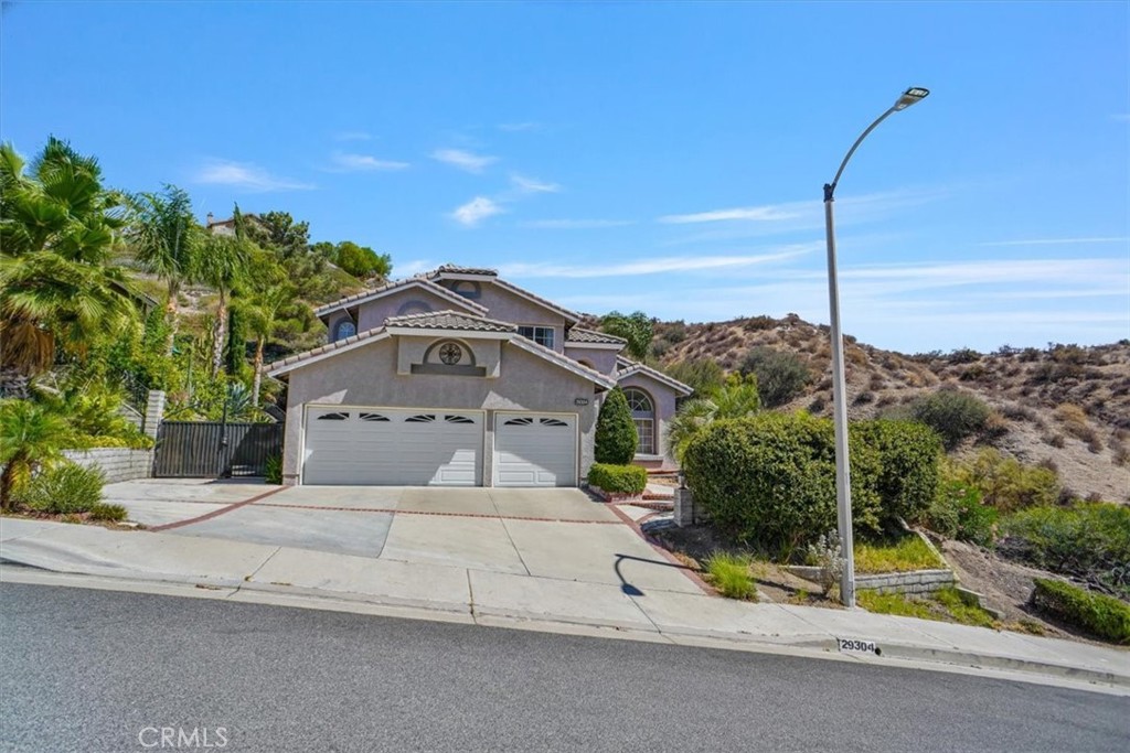 Absolutely, Immaculate "Mountain View East" Charmer with a Pool/Spa, Gated R.V., Panoramic View, and Only One Neighbor! This home offers a formal, double door entry, a one step down, vaulted ceilinged, formal living room and dining room combination, a freshly painted kitchen with new hardware, upgraded stainless appliances, an island and garden window over the sink, a walk-in pantry, and direct access into the family room complete with a brick trimmed fireplace and "wet-bar" cabinetry, a downstairs full bath with a custom walk-in shower enclosure, a laundry room with sink and cabinetry and direct access to a three car garage with "Epoxy flooring" and built-in storage. Upstairs is the primary suite at the rear of the home with a fireplace and ensuite with double sinks, a walk-in shower, "Jetted" soaking tub, privacy toilet area and a walk-in closet. There are 2 more bedrooms as part of the center hallway sharing a full bath with a tub/shower combination and double sinks. Upgrades and updates throughout include newer double front doors, brick laced walk ways and entry steps, fresh paint in the kitchen and primary suite, newer white trimmed dual pane slider and window set on side of living room with the panoramic view of the "valley", newer appliances, tiled counters in two bathrooms, newer fixtures and faucets, newer custom window sheers and blinds, a newer pool heater, a built-in BBQ, newer painted exterior, paved rear patio areas, succulent and cacti gardens, paved R.V. and so much more! Also note the rear yard is accessed via a French door from the family room and is an entertainer's dream with the pool and spa to enjoy while watching the sun set! This home is a must see for the discerning buyer!!