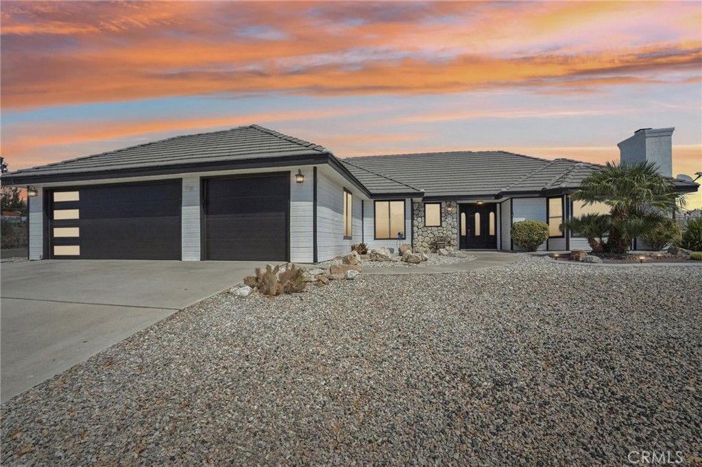 Welcome to your dream home in Apple Valley's finest community! This Stunning residence features 4 spacious bedrooms and 2 bathrooms well-appointed bathrooms, perfect for family living. The beautifully remodeled kitchen is a chef's delight, complemented by newer flooring and elegant baseboards that flow seamlessly throughout the home. Cozy up by the exquisitely upgraded fireplace in living room. Additional fireplace in family room. Fresh Interior and Exterior paint enhance the home's appeal, making it move-in ready. Enjoy the convenience of RV parking for all your toys, along with a greenhouse and shed that will remain with property, perfect for gardening enthusiasts or extra storage space. The expansive 3-car garage provides ample space for vehicles and storage. Step outside to take in the breathtaking views that surround this expectational property. Friendly community and great schools. Conveniently close to freeway, hospital, and stores. Don't miss this opportunity and be home for the holidays!