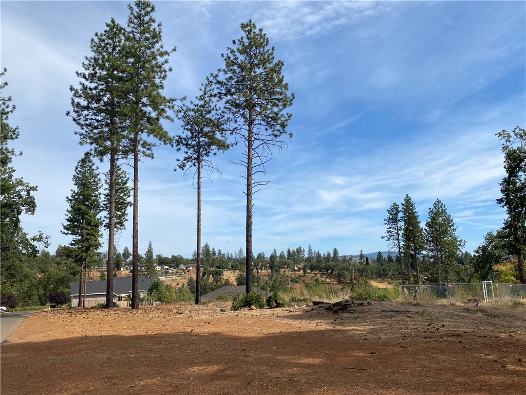 Prime 4.79-Acre Opportunity in Paradise!
Discover this exceptional property offering two separate parcels (3.57 & 1.22 acres) totaling 4.79 acres, prominently situated on a sweeping corner with frontage along Edgewood Lane, Windsong and Calico Lane. This unique setting provides both convenience and privacy, complemented by nice views and mature trees throughout.
Both parcels are nicely usable, have active Paradise Irrigation Department water accounts and had existing homes prior to the Camp Fire, creating an excellent opportunity for your dream home, multi-home family compound, or investment. Located in an area of quality homes, this property offers a serene setting while being just minutes from Lake Oroville and within an easy commute to both Chico and Oroville.
Don’t miss this rare chance to own a versatile property with so much potential in the heart of Paradise!