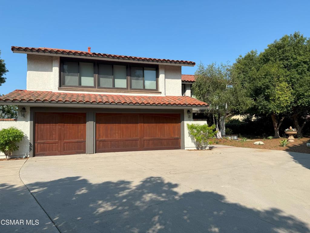 Private Sunset Hills 5BR/3BA estate with almost 3,000sf of living space, located on a desirable and private 13,700sf+ flag lot. The interior has been freshly painted and has a beautiful double door entry to the formal living room and dining room. The gourmet kitchen has granite counters, center island w countertop seating, farmhouse sink, upgraded lighting and updated cabinetry. The stainless steel appliances include large Viking 6 burner range w/griddle dual ovens, microwave, warmer drawer and dishwasher. Just off the kitchen is the family room with fireplace and backyard views. The open floor plan includes a downstairs bedroom with French doors to the backyard, a walk-in closet, and direct access to the downstairs bathroom. Upstairs primary suite with walk in closet and vaulted ceiling. The ensuite bathroom has been updated with dual vanity, a free standing bathtub, separate shower, custom lighting and tile floors. There are three additional upstairs bedrooms and a secondary bathroom with granite counters and subway tile shower/bathtub combo as well as a large upstairs multi purpose family room that brings in tons of natural light. Features include inside laundry room, central AC, wood floors, vaulted ceilings, recessed lighting, mirrored closet doors and custom light fixtures. The oversized lot has tons of privacy with low maintenance landscaping. Attached 3 car garage and plenty of additional driveway parking. Close proximity to shopping, dining & Sunset Hills Country Club where membership is available for pool, tennis, pickleball, & golf, etc.