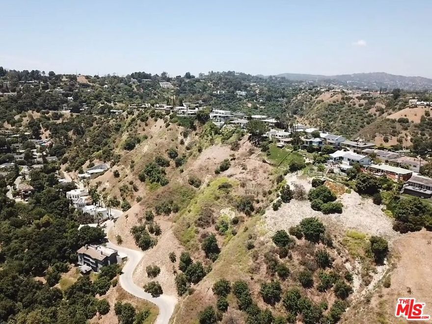APN: 2274-020-019. Discover a rare opportunity to own a substantial 3.37 acre lot, zoned LARE15, in the heart of Sherman Oaks.  This expansive lot is sloped and offers stunning city and canyon views nestled in a serene, quiet neighborhood near the Buckley School and Fossil Ridge Park.  Lot is currently landlocked and buyer would need to purchase one of the neighboring lots that fronts Camino De La Cumbre to gain street access and facilitate development.  Buyer to verify all information and rely on their own investigations.