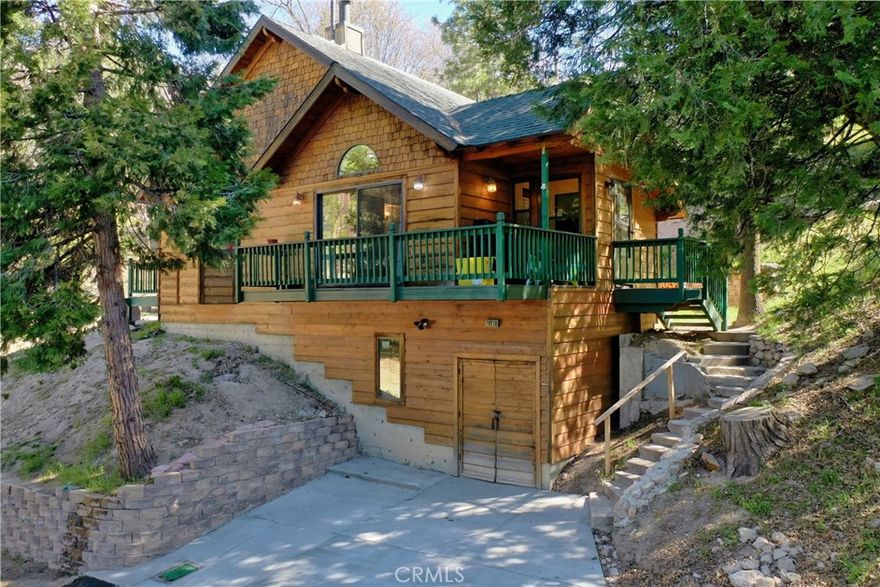 "Sellers Motivated"  New and Improved Pricing.. The residence encompasses a beautiful open floor plan with a lounging/TV room and Cathedral Ceilings and beautifully tiled fireplace. Wood Carved Handrails and Door Frames.  Primary Bedroom on the main floor. Two additional bedrooms upstairs one with a balcony.  Windows from all room allow sunlight into the home and makes one feel that you are in a treehouse with incredible views of the forest.  The home sits within a beautifully treed lot.  . Owner recently had the roof redone and a new driveway. The current owner purchased several lots that surround the property for more privacy, which is currently being combined into 1 lot total of 16353 sq ft. The home is close to hiking trails and parks.  Centrally located to Sky park and Snow Valley. Close to Cedar glen village for shopping and dining.
