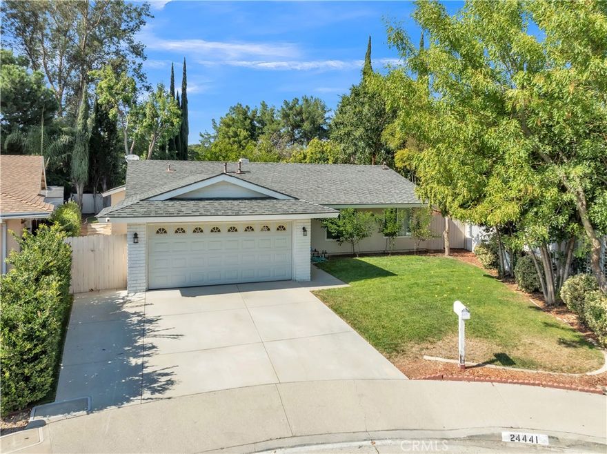 Welcome to 24441 Denise Place, a beautifully maintained 3-bedroom, 2-bathroom single-family residence with an additional office space, nestled on a peaceful cul-de-sac in the desirable Newhall community. Offering 1,603 sq. ft. of living space on a 5,671 sq. ft. lot, this home combines comfort, functionality, and versatility. Step inside to find a bright and inviting floor plan featuring a spacious living area, ideal for both relaxation and entertaining. The kitchen offers ample cabinetry and counter space, flowing seamlessly into the dining area and family room. Large windows bring in natural light, highlighting the warmth of this well-cared-for home. The primary suite provides a private retreat with its own bathroom, while two additional bedrooms and the dedicated office space offer flexibility for family, guests, work-from-home, or creative needs. Enjoy Southern California living in the private backyard, perfect for gatherings, gardening, or simply unwinding. An attached 2-car garage adds convenience, while the single-level design ensures easy accessibility. Located in a quiet neighborhood with close proximity to schools, parks, shopping, dining, and freeway access, this property presents an incredible opportunity to own a piece of Newhall charm.