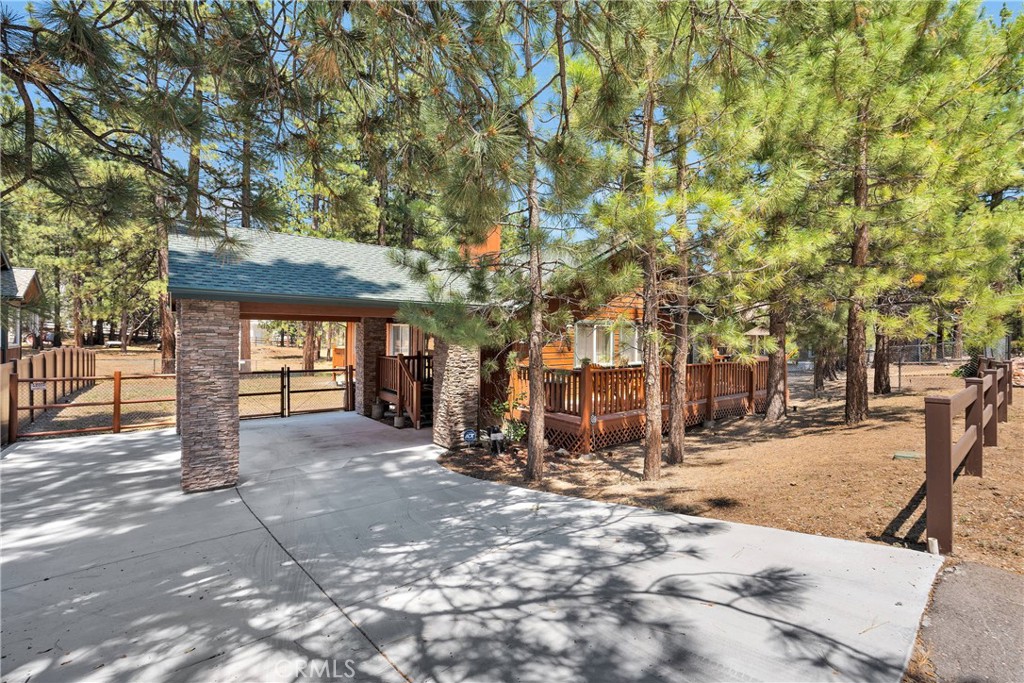 Charming Single-Story Home in Sought-After Fox Farm – Move-In Ready!
Welcome to your mountain dream home located in the highly desirable Fox Farm neighborhood—one of Big Bear Lake’s most established and sought-after communities. This beautifully maintained 3-bedroom, 2-bath single-story home offers the perfect blend of comfort, charm, and convenience.
As you arrive, you're greeted by a gorgeous one of a kind porte-cochère that adds both stunning curb appeal and practical, year-round functional protection from the elements as you arrive or greet guests. Step inside to discover a spacious, light-filled layout featuring a warm and inviting living area, a well-appointed kitchen with ample storage and counter space. this home is ideal for family, guests, or rental flexibility.
Enjoy the outdoors with a good-sized front porch, perfect for morning coffee or evening sunsets, and a private backyard and huge back porch with room to relax, entertain, or add your personal touch. The flat, easily accessible lot provides usable space and a peaceful mountain setting. The home is perfectly positioned just minutes from the lake, ski slopes, shopping, and top-rated restaurants. Whether you're hitting the slopes in winter or enjoying lake activities in summer, everything you love about Big Bear is right at your fingertips.
This home combines space, setting, and unbeatable location—making it ideal as a full-time residence, weekend getaway, or a lucrative investment property. With move-in ready condition, there's nothing to do but bring your bags and start enjoying the mountain lifestyle.
Don’t miss this rare opportunity to own in the heart of Big Bear’s Fox Farm. Schedule your private showing today!