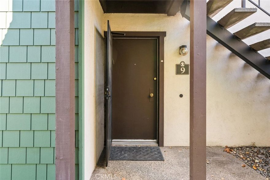 Tucked away in this charming private courtyard of lush greenery, this beautiful condo is ready for its new owner.  Move in ready, it features fresh paint, new carpet, granite countertop, large tile shower, and attractive vinyl flooring.  Cuddle up next to the cozy fireplace or enjoy your morning coffee in your own private attached patio.  Conveniently located near shopping, restaurants, bus lines, fabulous downtown Chico, CSUC and our historic Bidwell Park-perfect for a weekend stroll.  'Woodoak' community offers a welcoming setting including a club house with Bluetooth features, salt-water pool, hot tub and sauna. HOA includes water and garbage services. Blending everyday convenience with a friendly and relaxing atmosphere is the perfect balance of comfort and charm.  Come see for yourself! You will be excited!