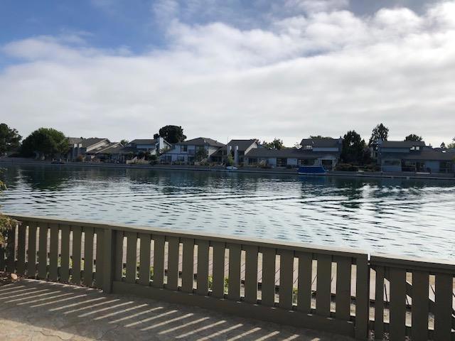 Wide Waterfront~Updated 3bd/2.5ba with approx. 1546 sf home awaits! Set sail from your waterfront townhome with direct access to the waterway. Imagine stand-up paddle boarding, sailing, kayaking and canoeing activities! You can store your watercraft at the water's edge (pls. confer w/ HOA). Watch FCs annual 4th of July Fireworks from the comforts of your own low maintenance patio too! Engineered Hardwood Floors. Cottage cheese ceiling was removed, textured and painted giving it a contemporary vibe! Updated kitchen with cherry stain cabinetry, granite countertops and tile floors. Updated Baths too. 1 Car Garage w/ 1 Car carport. Isle Cove community offers a clubhouse, pool, spa, children's play area and tennis court. Convenient to shops, parks and acclaimed Foster City elementary school and MORE! Sorry owner requests NO Pets..