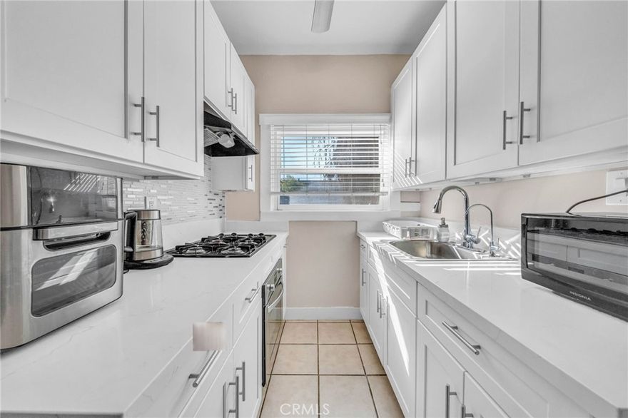 Charming crisp and clean renovated Condo in Historic Figueroa Arms – Prime Downtown LA Location! Discover this bright and inviting 1-bedroom, 1-bathroom condo in the iconic Figueroa Arms, a historic Southern California building that perfectly blends old-world charm with modern convenience. This second-floor unit showcases a remodeled kitchen that's sure to impress! Featuring sleek white cabinetry, luxurious quartz countertops, and a stylish custom backsplash, this space is both functional and visually striking. The stainless steel appliances, including a gas cooktop and gas oven, offer the perfect blend of modern convenience and culinary excellence. In addition this home features hardwood floors, elegant French doors, a spacious closet with built-ins, and large windows offering natural light and courtyard views. Located in a prime Downtown LA spot, this home is eligible for the USC Neighborhood Homeownership Program, making it a fantastic opportunity for both homeowners and investors. Building Amenities include, lushly landscaped central courtyard with a green belt, spacious gym & laundry facilities, public dog run & picnic area, HOA includes security, water, trash, and exterior maintenance. Gated parking is also available for rent. Conveniently situated minutes from the 110 Freeway, Crypto Arena, Exposition Park, the Expo Line at USC, the metro station, and BMO Stadium, this home offers unbeatable accessibility to all that Downtown LA has to offer. Don’t miss out on this rare opportunity!