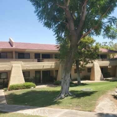 Palm Springs Villas II Gated Community, Fully Furnished One bedroom, One bath upper level condo with amazing view of grassy and trees with community pool off to the side. The community offers a resort living life style with several Pools & Spas, Tennis & Pickleball courts, and a putting green. Water, hot water, internet and trash are paid for. Newly painted and newer windows. Close to downtown Palm Springs and Tram.