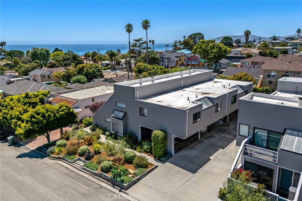 Discover coastal living in this stylish 2-bedroom, 2-bath condo nestled in the heart of Shell Beach Village. Boasting 1,005 square feet, this end unit offers privacy with only one shared wall and features two dedicated parking spaces. Enjoy partial ocean views and cool sea breezes from your private balcony. Located just down the street from scenic Eldwayen Ocean Park.
The versatile layout includes a downstairs bedroom with its own private bath—ideal for guests or a home office. Travertine tile flooring accents the lower level and staircase. Upstairs, the main living area features vaulted ceilings, skylights, beautiful hardwood floors, a second bedroom, and a guest bathroom. The kitchen is well-appointed with granite countertops, stainless steel appliances, and a bar countertop. The dining area offers space for entertaining or having a quiet night in.
There is a fully fenced private front patio that’s perfect for soaking up some sun or grilling. With its unbeatable location—just a short stroll to the beach, shops, and local restaurants—this is your opportunity to own a piece of the Shell Beach lifestyle. Location, location, location!