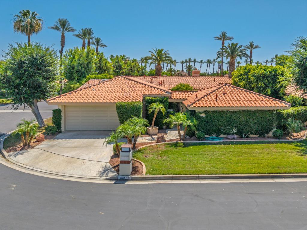 Tucked along a gentle stream that meanders throughout the complex with a freshly painted interior, this beautifully updated home offers a relaxed yet refined lifestyle. A private detached casita provides ideal space for guests. Inside, enjoy soaring beamed ceilings, a remodeled kitchen, and two remodeled bathrooms, massive fireplace & near a pool & spa. Outdoors, lush landscaping, multiple sitting areas, an upgraded quartzite patios with a built-in BBQ island create the perfect backdrop for entertaining or quiet moments. Set in a sought-after gated community with sparkling pools and tennis courts, this home also includes an oversized 2-car garage plus golf cart area and storage, an indoor laundry, and a flexible floor plan. 2 bedrooms plus a den that could easily serve as a 3rd bedroom. A wonderful blend of comfort, style, and convenience.