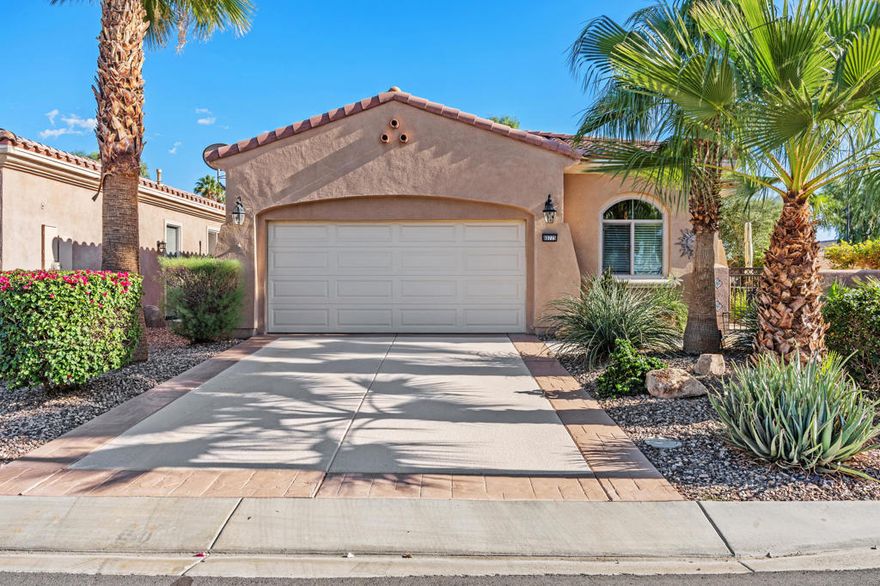 With cooler weather and sunny skies, now is a great time to buy a fully furnished desert home. Start enjoying everything that the desert has to offer in fall and winter.  Enter through your private gated courtyard, perfect for morning coffee into this turnkey property offering a freshly painted interior with new flooring, and new window blinds. A new AC was installed last year and in the kitchen the owners installed under cabinet lighting, a new refrigerator, dishwasher, sink faucet, pull out shelves, and tile backsplash. In the garage they installed a new garage door opener, epoxy flooring, cool coated driveway and walkways, custom cabinets and workbench for your handyman projects. In the backyard is a covered patio with disappearing screen, private BBQ, citrus trees and a putting green. Enjoy the close proximity to the activities and facilities of the Montecito Clubhouse just outside your door with an indoor pool, outdoor pool/spa, fitness center, library, billiards room, tennis courts, 18 hole putting course and bocce courts. Be in the center of it ALL and still have the privacy and serenity of the sheltered courtyard and entertainer's backyard space. Sun City Shadow Hills is a premier 55+ active adult community with two golf courses, two club houses, a restaurant and over 50+ clubs.