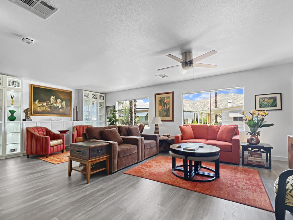 This beautifully updated manufactured home is located on a very quiet street in the picturesque South Palm Desert community of Indian Springs (55+). VIEWS, VIEWS, VIEWS. With virtually no road noise, you can relax on your covered patio with your morning coffee and evening class of wine while enjoying the sounds of nature and visiting with friendly neighbors. All this beauty and serenity is just 2 short miles up from the renowned El Paseo shopping and dining district. This comfortable home is extremely affordable with LOW SPACE RENT (rent controlled), NO MANDATORY HOA DUES, and NO REAL ESTATE PROPERTY TAXES! Space rent for the new buyer is only $657.22/mo.A major remodel was completed in 2024: All new chef's kitchen with expansive quartz countertops, LG appliances, and an abundance of cabinets and drawers. Gorgeous and durable new grey laminate flooring flows throughout the home and a built-in wall of lighted display cabinets are featured in the living room. The interior is fully drywalled and both the inside and outside were recently painted. You will appreciate the expanded walk-in closet in the main bedroom, 11 foot long pantry, and all new custom 2'' aluminum Bali Blinds. A new Owens Corning shingle roof (with a transferable warranty) was just installed making INSURANCE EASY TO OBTAIN. Also, the plumbing and sewer lines have been replaced.Outside, there is a long covered patio, covered parking, two storage sheds, and a large backyard that could be fenced for privacy or pets.Low monthly space rent in Indian Springs is protected by Rent Control, with water and sewer included. Privately owned park (not Indian Land). No real estate property taxes! The clubhouse, pool & spa, shuffleboard, and greenbelts are included for all residents, and there is a voluntary Social Club HOA if you choose to join. Call your agent today for a showing!
