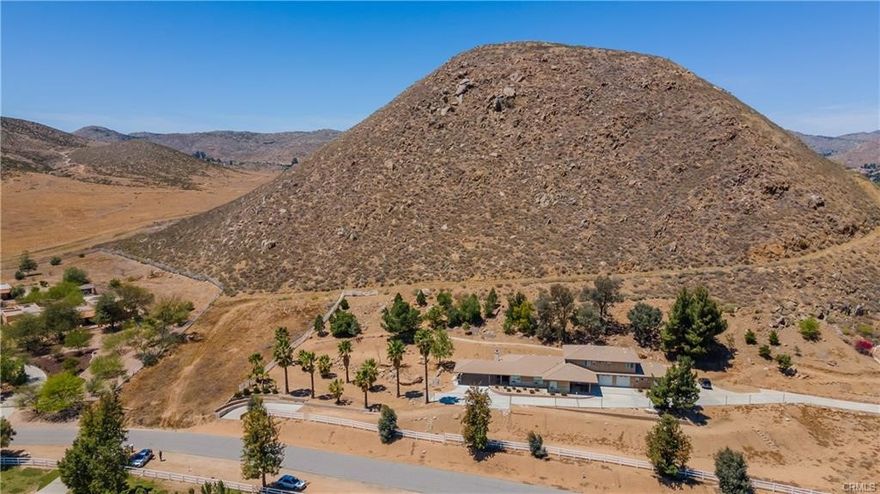 Welcome to the Winchester Valley! This rare and exceptional opportunity allows you to own a private mountaintop with breathtaking panoramic views. Located in a well-established neighborhood, this property offers an unparalleled vantage point overlooking Winchester, Hemet and San Jacinto valleys, with an expansive view of Diamond Valley Lake. The property features an active water meter and includes a sizable pad area at both the base and top, ready for development. From the base, a widened dirt road provides easy access to the summit, where you'll be treated to a stunning "eagle’s view" in complete privacy. This one-of-a-kind property is a rare gem, offering the unique opportunity to be the sole owner of such a prime mountaintop location, making it a truly special retreat. Don't miss out on this exceptional chance to own your own piece of paradise!