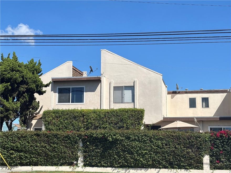 This exceptional two-story condominium in Paramount offers three spacious bedrooms, two and one-half bathrooms, hardwood flooring throughout, and tile in the bathrooms.  The kitchen and bathrooms feature elegant granite countertops, and a two-car garage includes laundry facilities.  This desirable property is expected to sell quickly.